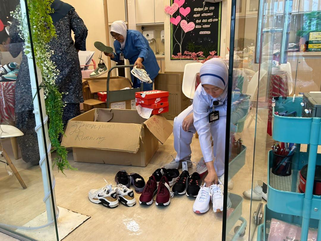 Nike Shoe Distribution to Hospital Staff and Child Patients - Photo 1