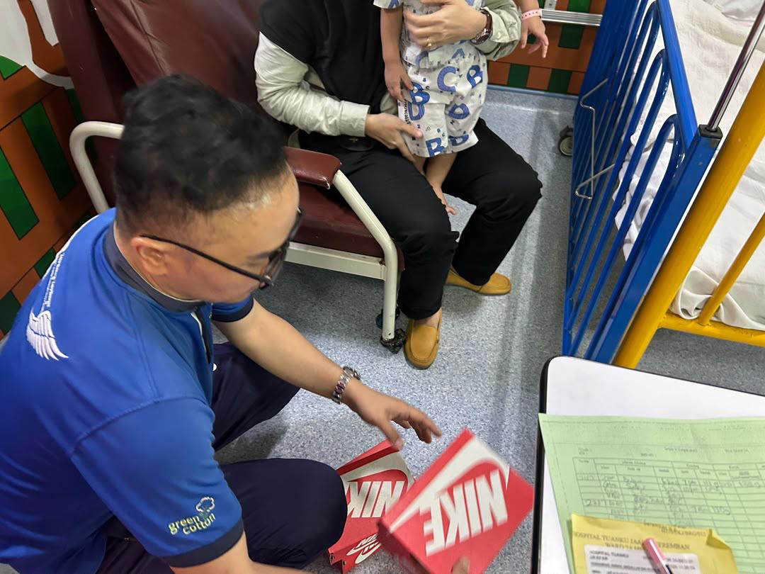 Nike Shoe Distribution to Hospital Staff and Child Patients - Photo 19